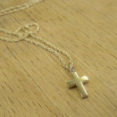 Small yellow gold cross on a chain. By Marcus Ó Broin Jewellery, Kelowna, BC