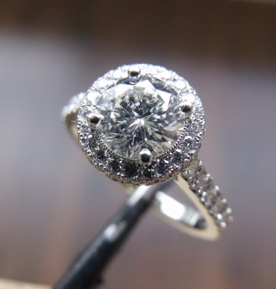 Large round diamond, set in a round halo ring with micro pave set diamonds in white gold By Marcus Ó Broin Jewellery, Kelowna, BC.