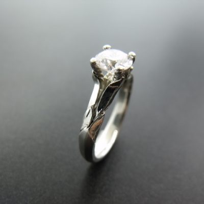 Claw set diamond ring in white gold with floral decoration. By Marcus Ó Broin Jewellery, Kelowna, BC