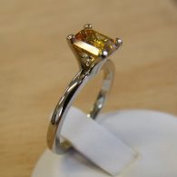 Solitaire 18 karat white gold solitaire engagement ring with an emerald cut yellow sapphire. By Marcus Ó Broin Jewellery, Kelowna, BC