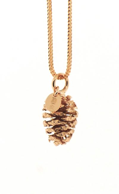 Red gold casting of an actual pinecone approximately 12mm in height. it is hanging on a red gold chain. by Marcus Ó Broin Jewellery, Kelowna, BC