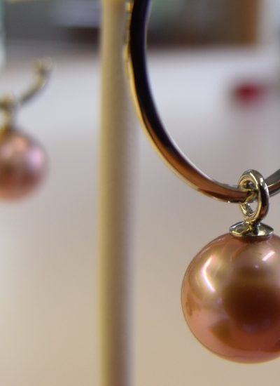 Fresh water pearl hanging on a white gold hoop. By Marcus Ó Broin Jewellery, Kelowna, BC